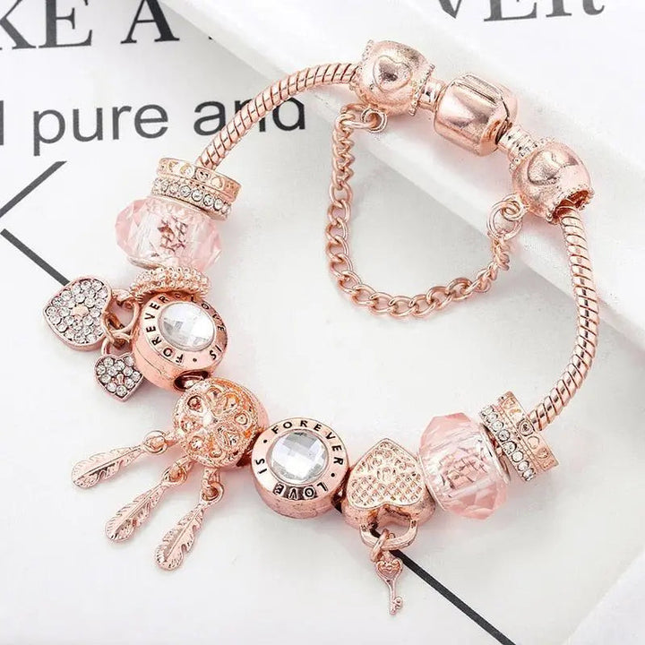 Bracelet Attrape-Rêves Rose avec Charms en Argent Sterling Inclus" can be rewritten as:

"Bracelet Rose Attrape-Rêves avec Charms en Argent Sterling