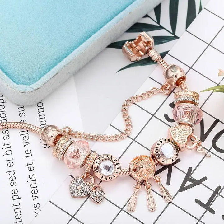 Bracelet Attrape-Rêves Rose avec Charms en Argent Sterling Inclus" can be rewritten as:

"Bracelet Rose Attrape-Rêves avec Charms en Argent Sterling