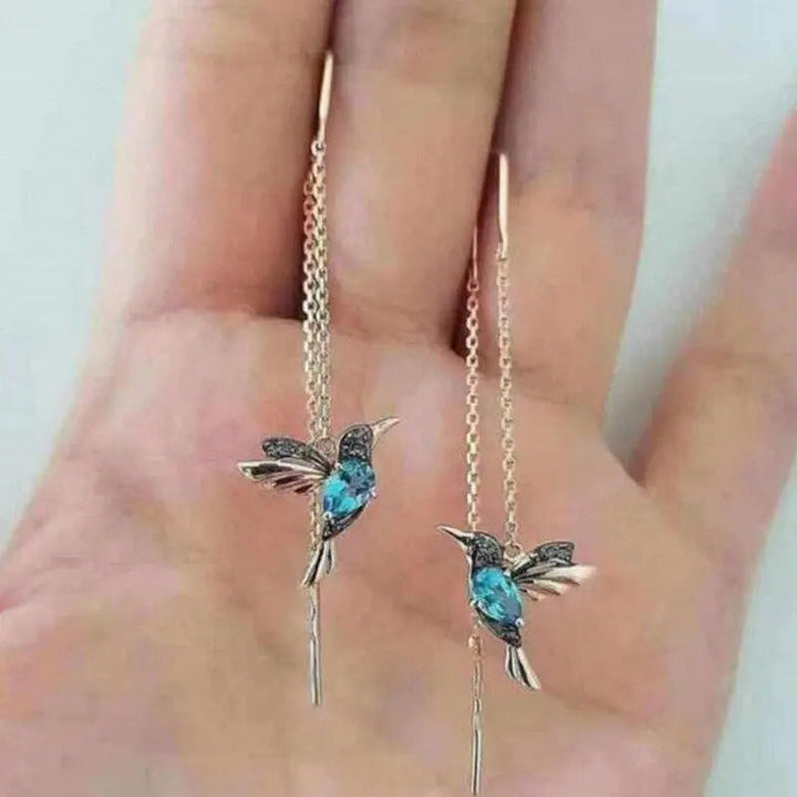Boucles d'oreilles en or ornées d'un colibri et de cristaux